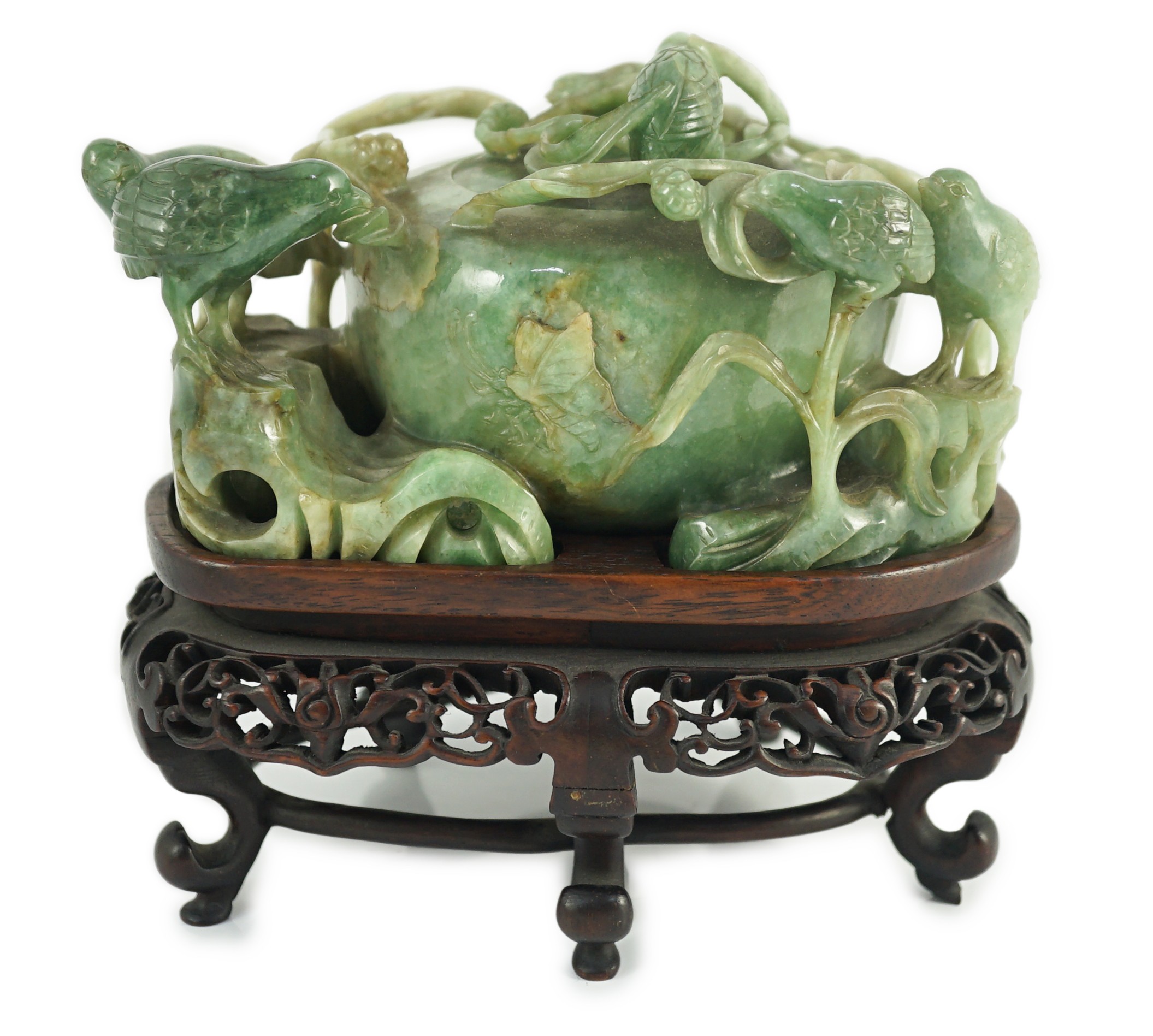 A Chinese jadeite ‘quail and millet’ water pot and stand, late 19th century, original carved and pierced wood stand, total width 15.2cm